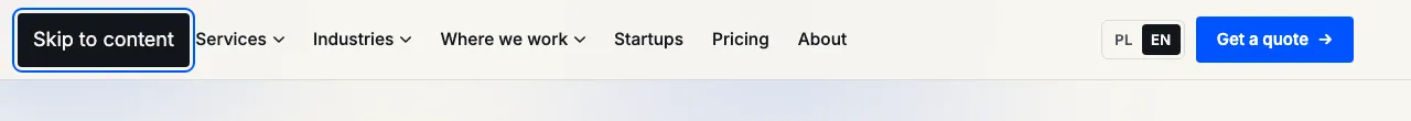 After the first Tab, a dark "Skip to content" button with a blue outline appears in the top-left corner of the page
